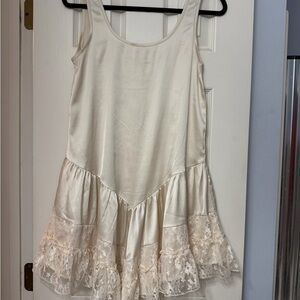 Elegant Cream Sleeveless Dress with Lace Hem